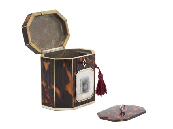 Front overview of the Pressed Tortoiseshell Tent Top Tea Caddy with the lid up and compartment lid removed