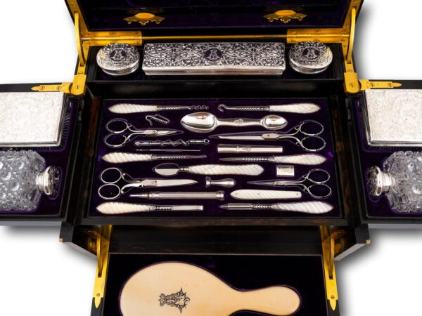 Close up of the interior tool tray in the Burr Walnut and Silver Mechanical Vanity Box Royal Connection