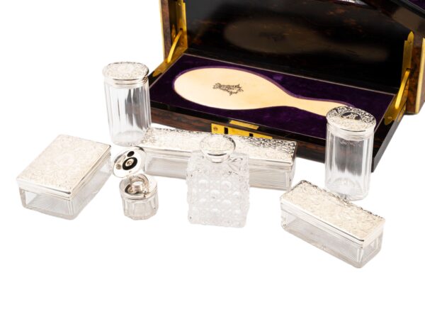 Close up of the contents inside the Burr Walnut and Silver Mechanical Vanity Box Royal Connection