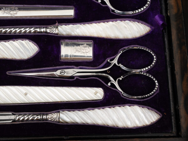 Close up of the mother of pearl tools inside the Burr Walnut and Silver Mechanical Vanity Box Royal Connection