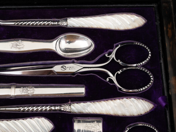 Close up of the mother of pearl tools inside the Burr Walnut and Silver Mechanical Vanity Box Royal Connection