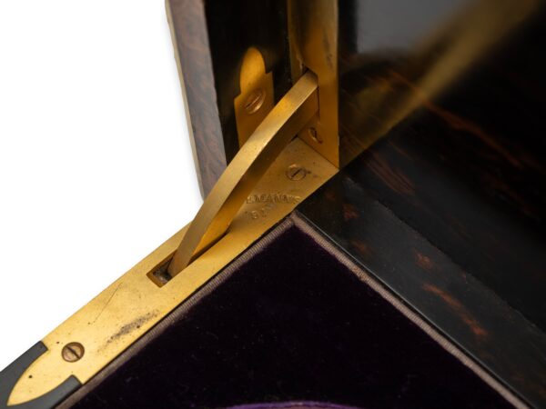 Close up of the gilt brass hinges inside the Burr Walnut and Silver Mechanical Vanity Box Royal Connection