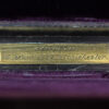 Close up of the Kenneth plaque in the rear of the Feathered Burr Walnut Decanter Box Betjemann Kenneth