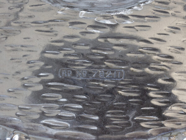Close up of the Cocktail Fruit Squeezer Hukin & Heath registration mark