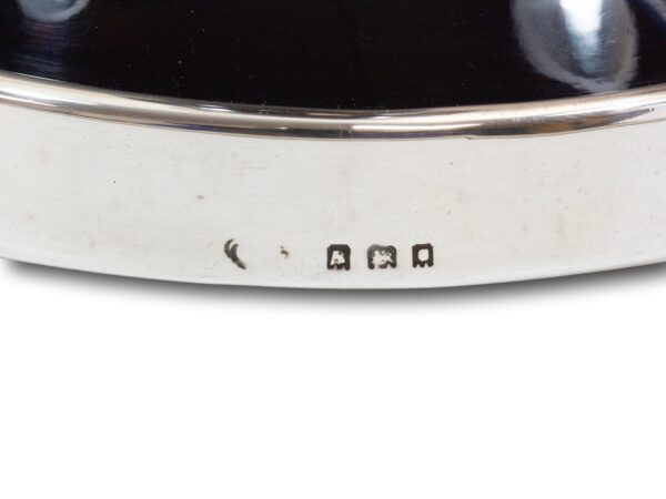 Close up of the silver hallmarks on the Silver and Tortoiseshell Candlesticks Asprey