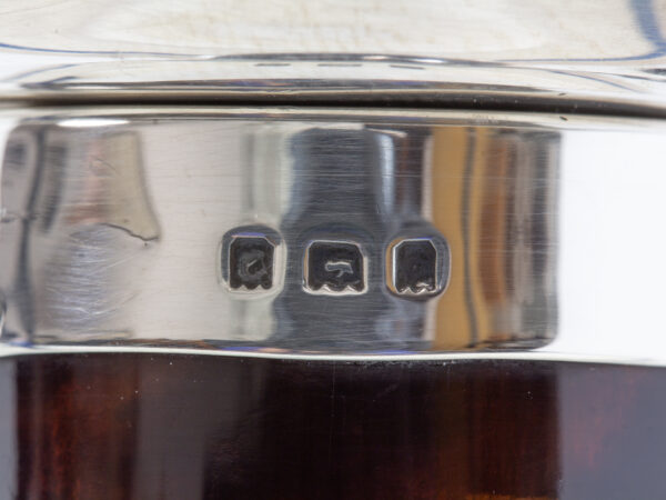 Close up of the silver hallmarks on the Silver and Tortoiseshell Candlesticks Asprey
