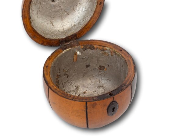 Front of the Antique Continental Melon Fruit Tea Caddy with the key fitted with the lid up showing the inner lining