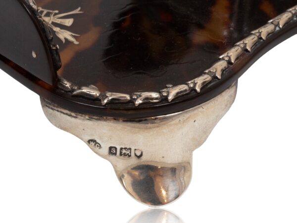 Close up of the sterling silver feet from the Tortoiseshell and Silver Inkwell William Comyns