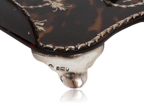 Close up of the sterling silver feet from the Tortoiseshell and Silver Inkwell William Comyns