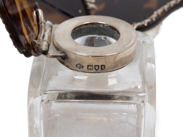 Close up of the sterling silver hallmarks on the Tortoiseshell and Silver Inkwell William Comyns